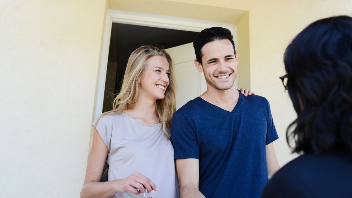 Couple receiving keys to their new home, representing mortgage approval and homeownership in Ireland