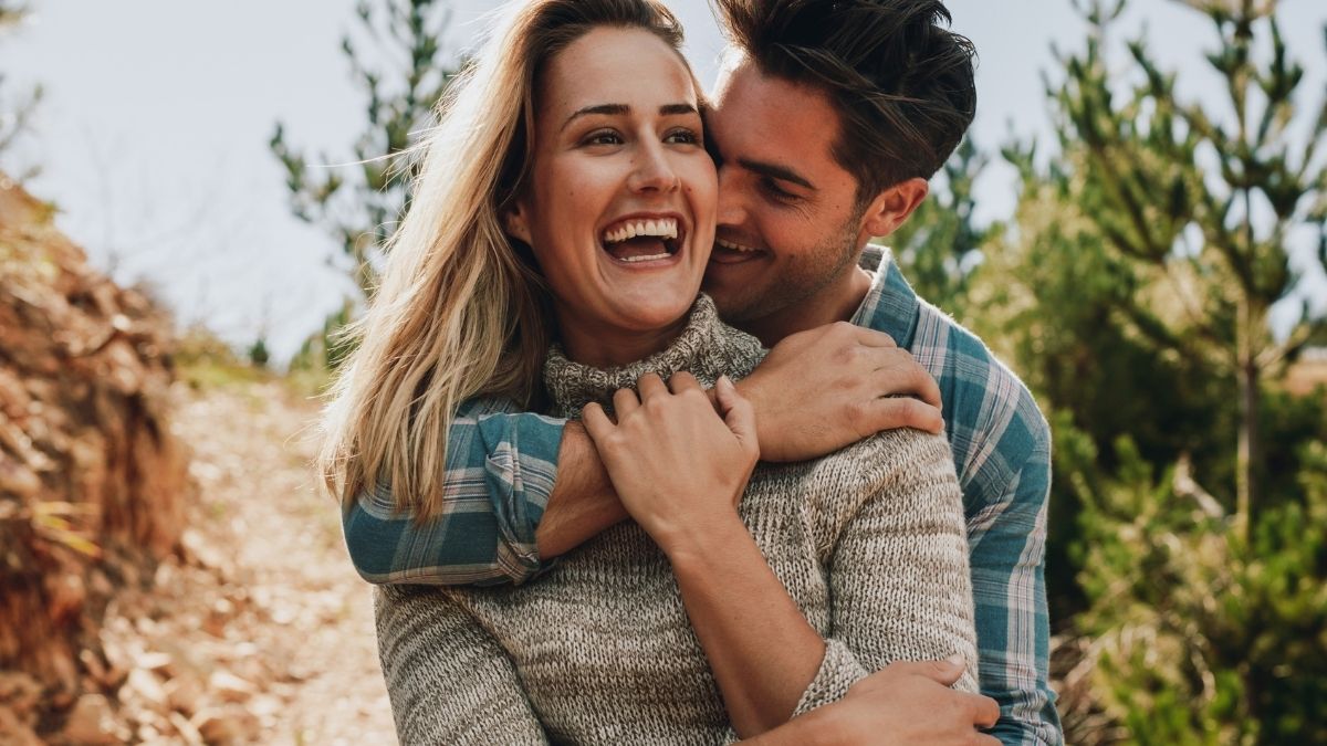 Happy couple embracing outdoors, representing moving forward after cancer and planning for homeownership in Ireland